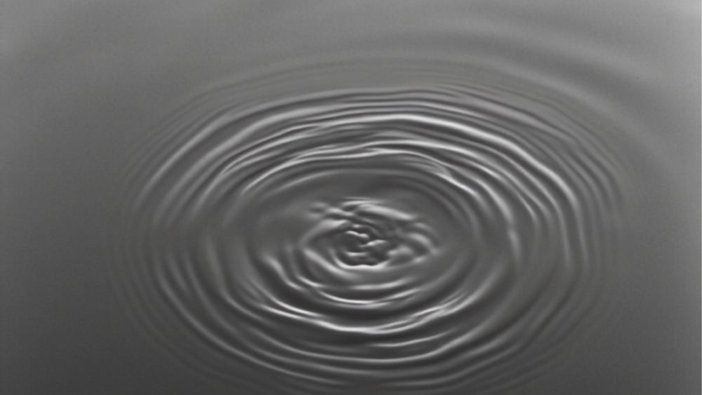 Overlapping ripple patterns on still water, representing why two people see things differently.
